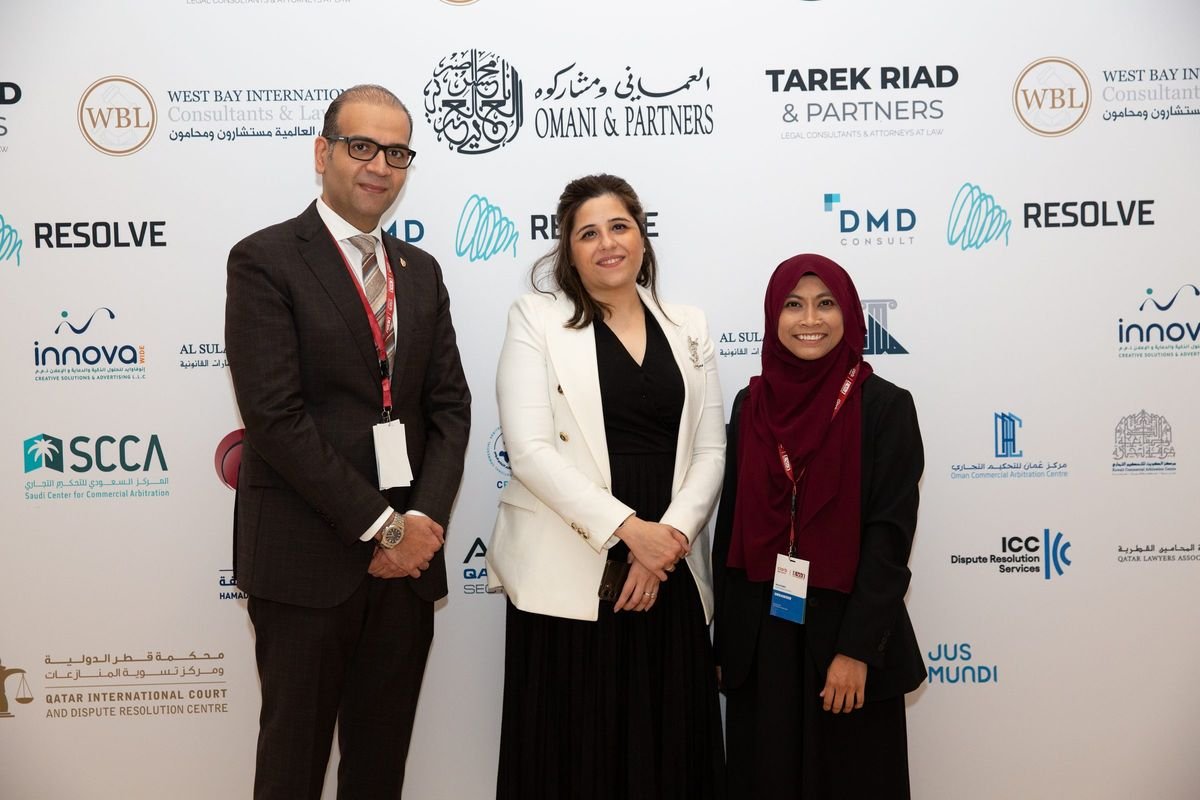 Group photograph at the sponsor wall, 1st Doha Arbitration Day